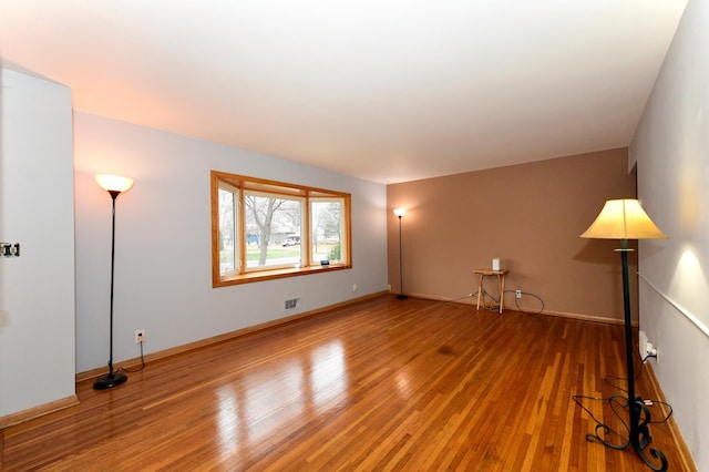 unfurnished living room featuring wood-type flooring