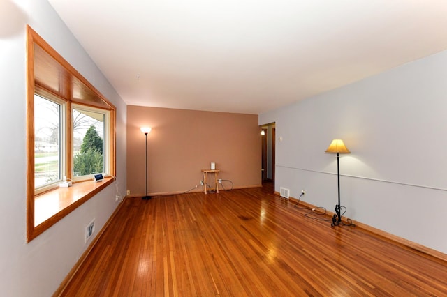 empty room featuring hardwood / wood-style floors