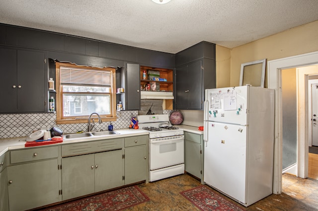 kitchen with tasteful backsplash, white appliances, sink, and a textured ceiling