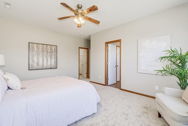 bedroom featuring ceiling fan and light colored carpet