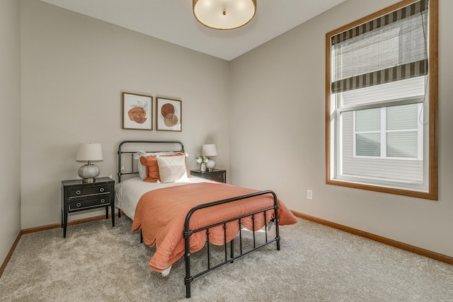 carpeted bedroom featuring lofted ceiling