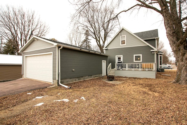 view of front facade with an outbuilding and a garage