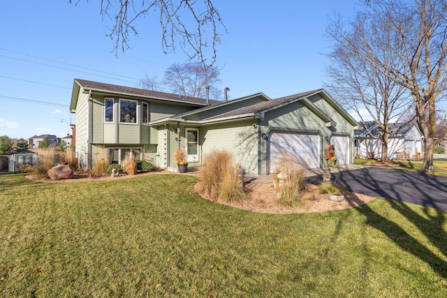 view of front of property with a garage and a front yard