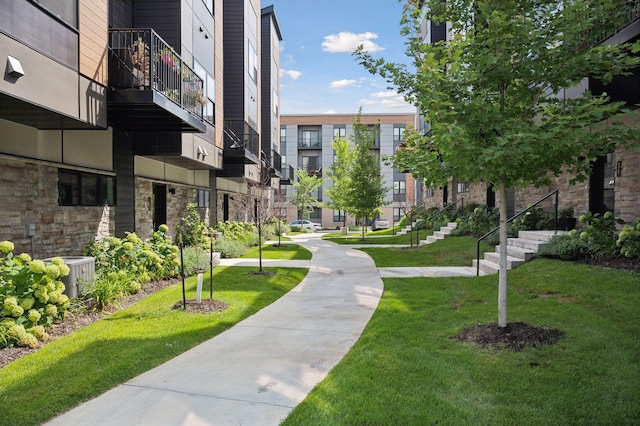 view of property's community featuring a yard