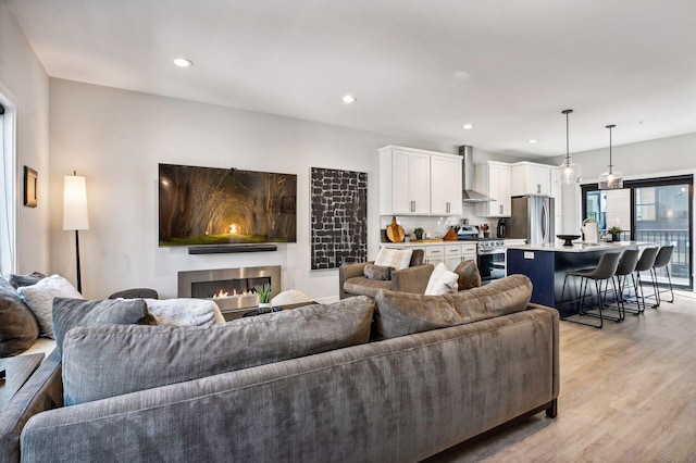 living room with light hardwood / wood-style flooring