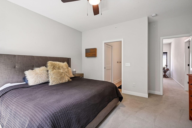 bedroom featuring light colored carpet and ceiling fan