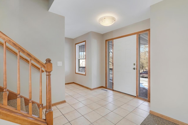 entrance foyer with light tile patterned floors