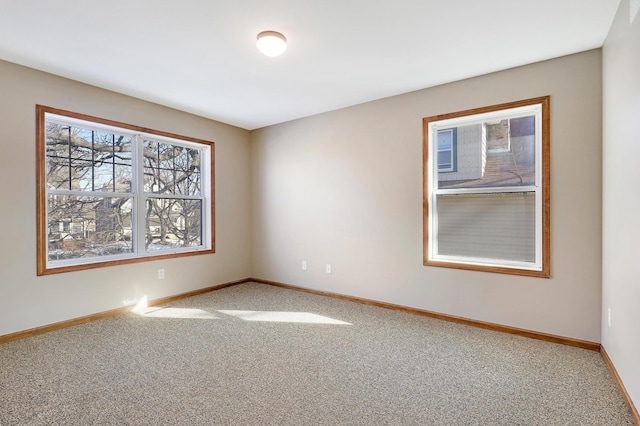 unfurnished room featuring carpet flooring