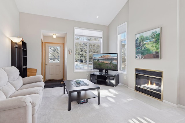 living room featuring light carpet and lofted ceiling