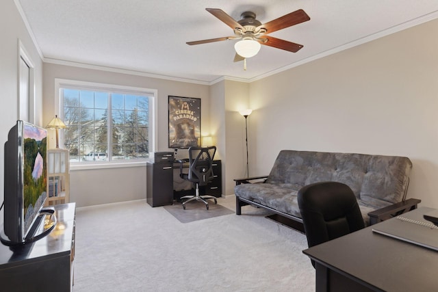 office featuring ornamental molding, ceiling fan, and light colored carpet