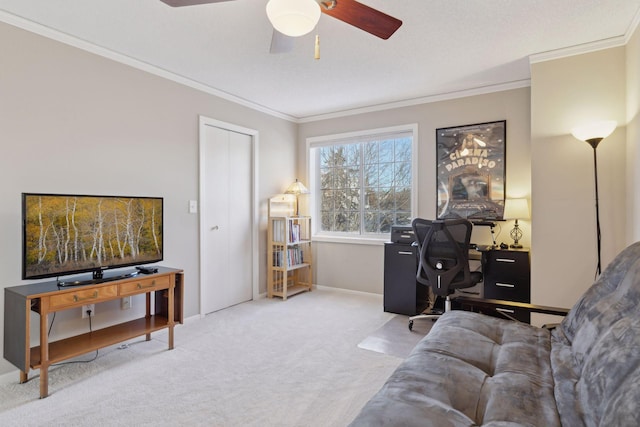 carpeted living room with ceiling fan and crown molding