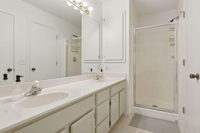 bathroom featuring vanity, tile patterned floors, and a shower with door