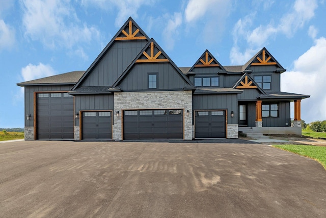 view of front of property with a garage and covered porch