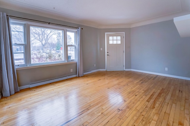 entryway with a baseboard heating unit and light wood-type flooring