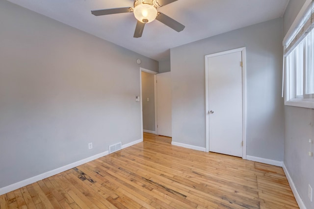 unfurnished bedroom with ceiling fan and light hardwood / wood-style flooring