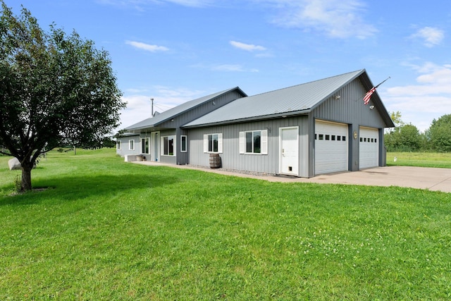 exterior space with a garage and a yard