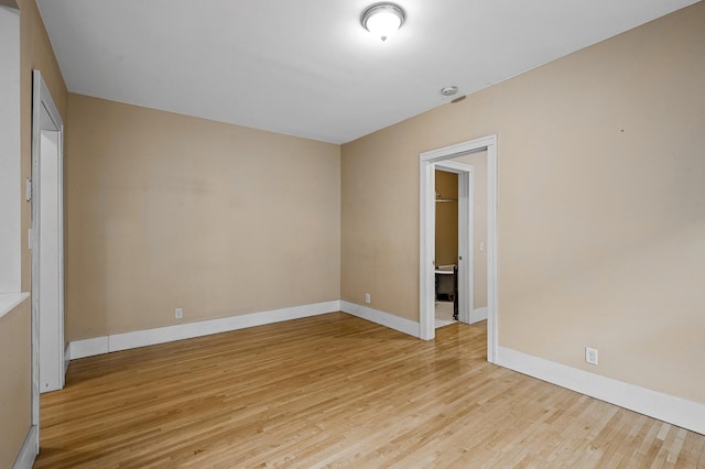 unfurnished room featuring light hardwood / wood-style flooring