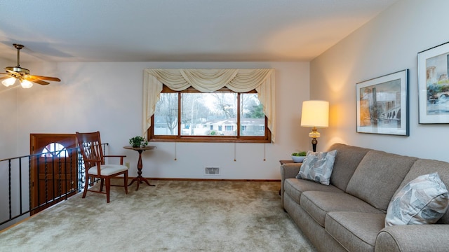 living room with ceiling fan and carpet