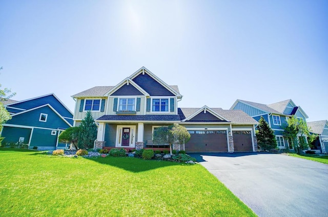 view of front of house with a garage and a front lawn