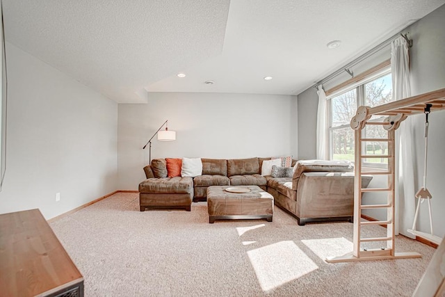 carpeted living room with a textured ceiling