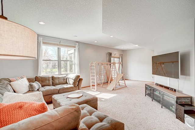 carpeted living room with a textured ceiling