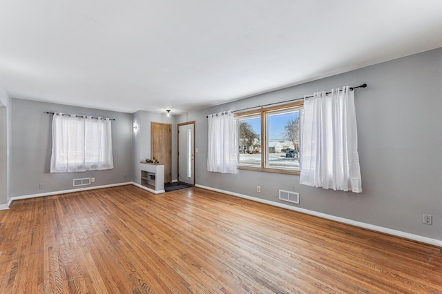 unfurnished living room featuring light hardwood / wood-style flooring