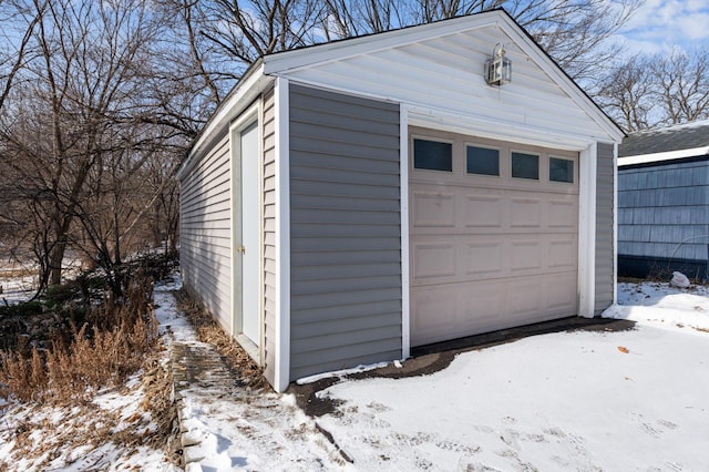 view of snow covered garage