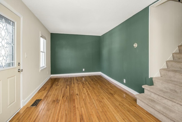 foyer entrance with hardwood / wood-style flooring