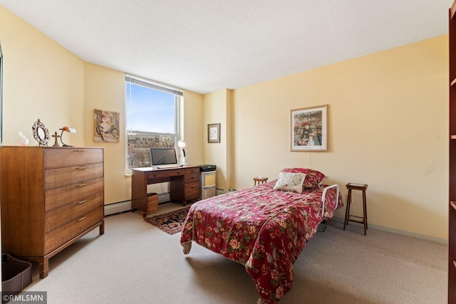 carpeted bedroom featuring a baseboard radiator