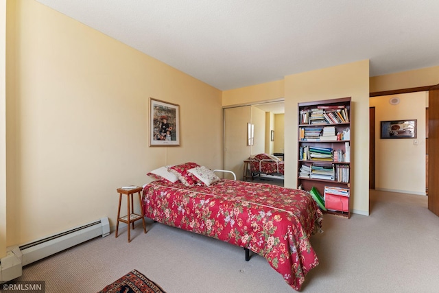 bedroom featuring a baseboard radiator, a closet, and carpet