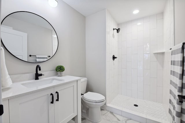 bathroom featuring vanity, curtained shower, and toilet