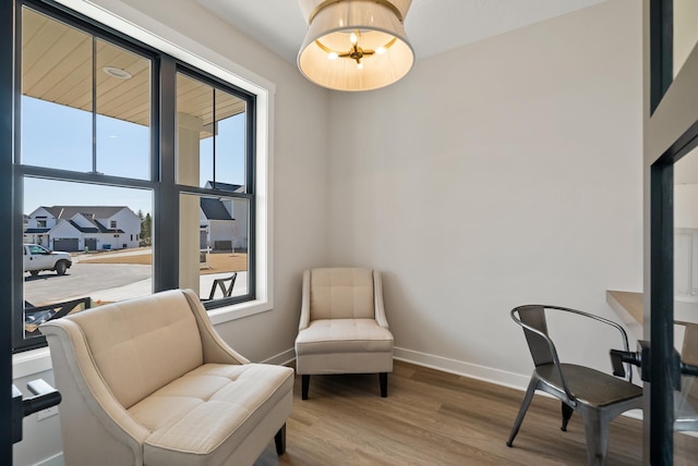 18436 56th Ct N, Plymouth, MN 55446 - sitting room featuring baseboards and wood finished floors