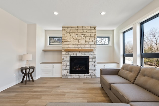 18436 56th Ct N, Plymouth, MN 55446 - living room with light wood-type flooring, recessed lighting, a fireplace, and baseboards
