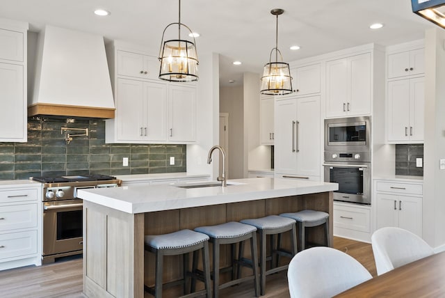 18436 56th Ct N, Plymouth, MN 55446 - kitchen featuring stainless steel appliances, premium range hood, a sink, a chandelier, and light wood-style flooring