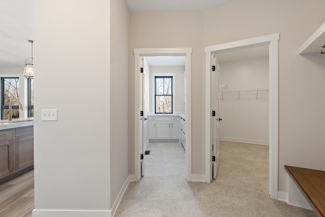 18436 56th Ct N, Plymouth, MN 55446 - hallway with a sink and baseboards