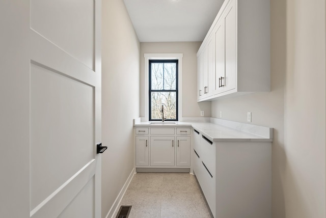 18436 56th Ct N, Plymouth, MN 55446 - washroom featuring a sink and baseboards