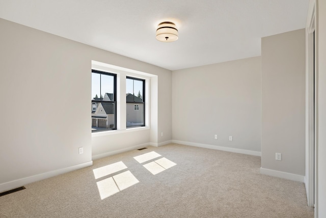 18436 56th Ct N, Plymouth, MN 55446 - unfurnished room featuring light colored carpet and baseboards