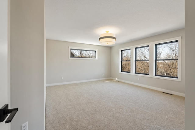 18436 56th Ct N, Plymouth, MN 55446 - carpeted empty room featuring healthy amount of natural light and baseboards