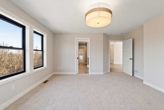 18436 56th Ct N, Plymouth, MN 55446 - unfurnished bedroom featuring light carpet and baseboards
