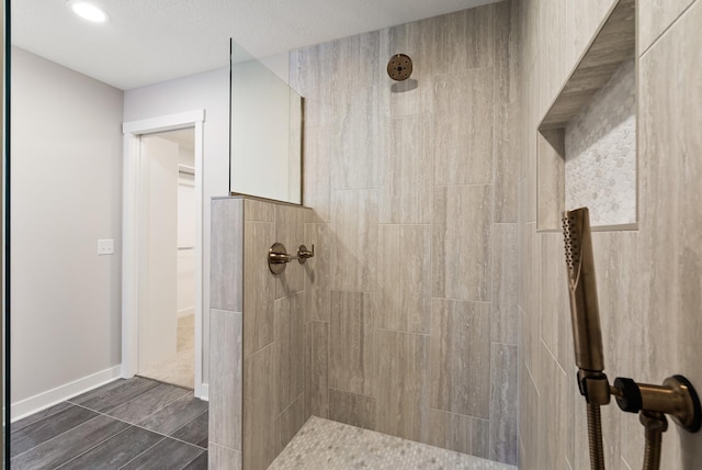 18436 56th Ct N, Plymouth, MN 55446 - bathroom with a tile shower, baseboards, and recessed lighting