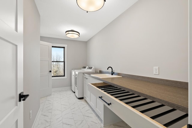 18436 56th Ct N, Plymouth, MN 55446 - washroom with washer and dryer, light marble finish flooring, cabinet space, and baseboards