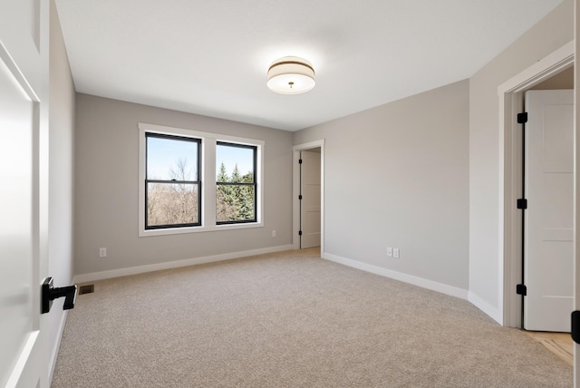 18436 56th Ct N, Plymouth, MN 55446 - unfurnished room featuring light carpet and baseboards