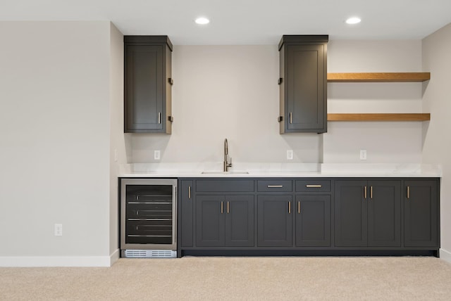 18436 56th Ct N, Plymouth, MN 55446 - bar area featuring wine cooler, a sink, carpet floors, baseboards, and recessed lighting