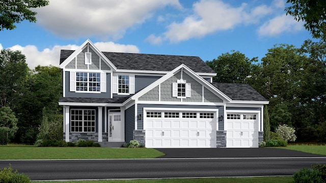 view of front of home featuring a garage and a front lawn