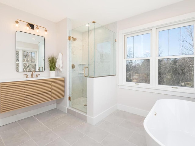 bathroom featuring tile patterned flooring, vanity, and plus walk in shower