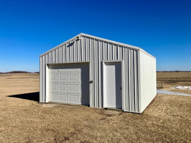 garage featuring a rural view