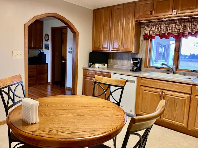 kitchen with sink, dark hardwood / wood-style floors, and dishwasher