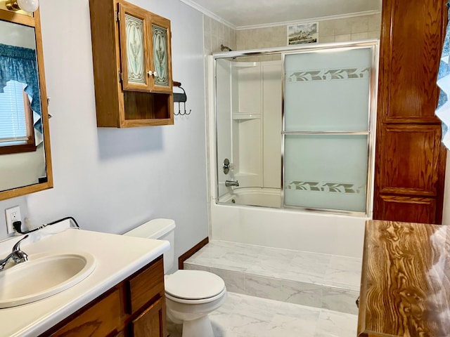 full bathroom featuring enclosed tub / shower combo, vanity, crown molding, and toilet