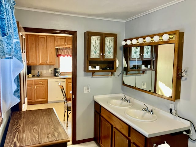 bathroom with ornamental molding and sink