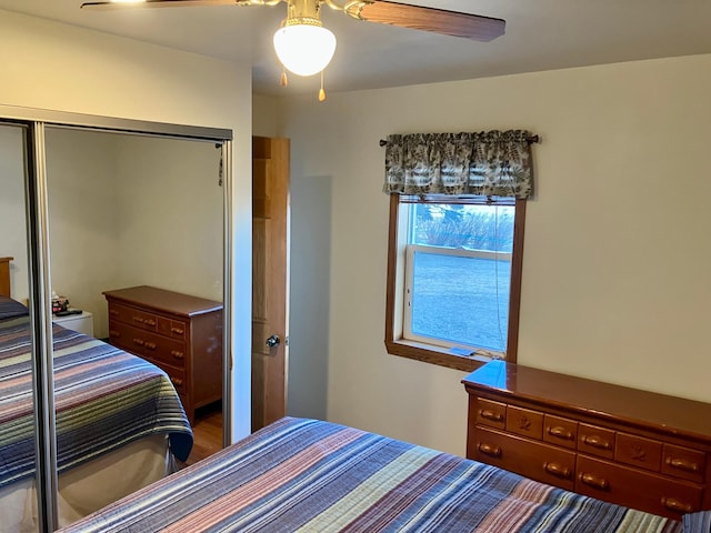 bedroom featuring ceiling fan and a closet